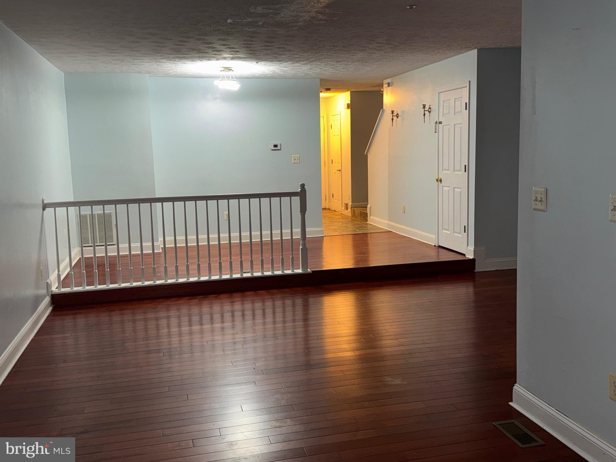 7148 Natures Road Columbia, MD 21046 - Photo 37 of 49 a view of a hallway with wooden floor