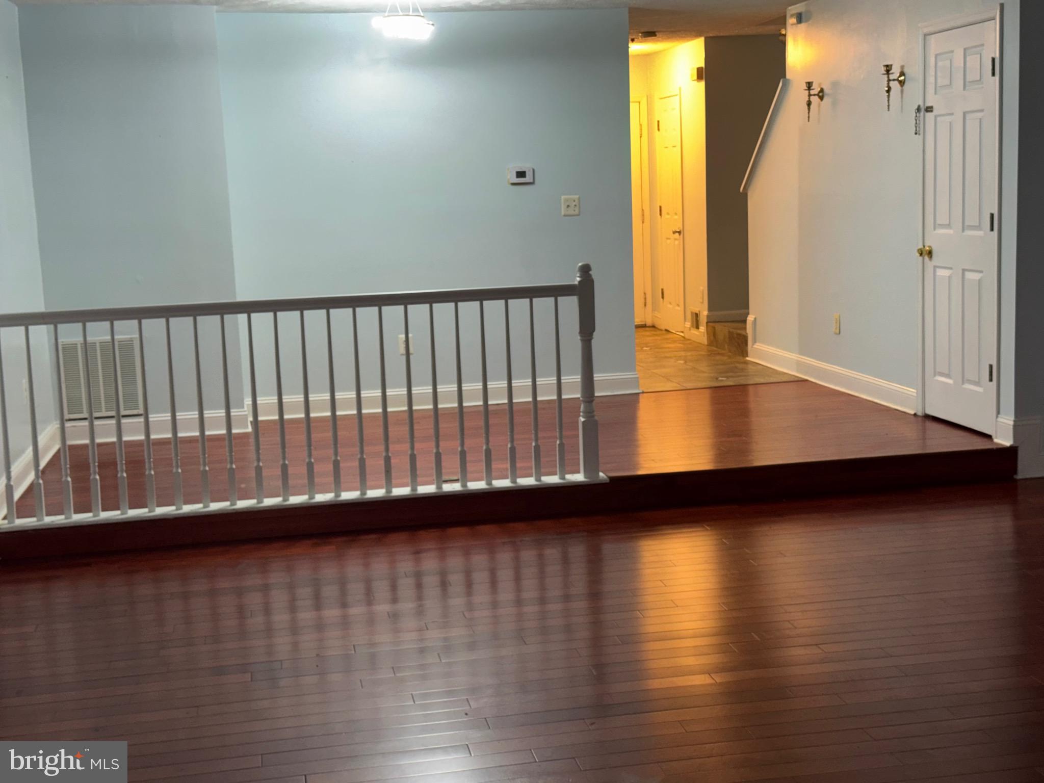 7148 Natures Road Columbia, MD 21046 - Photo 38 of 49 a view of empty room with wooden floor and fan