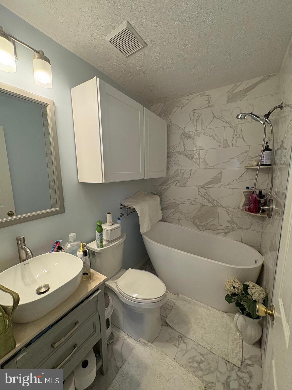 7148 Natures Road Columbia, MD 21046 - Photo 4 of 49 a bathroom with a sink toilet and shower