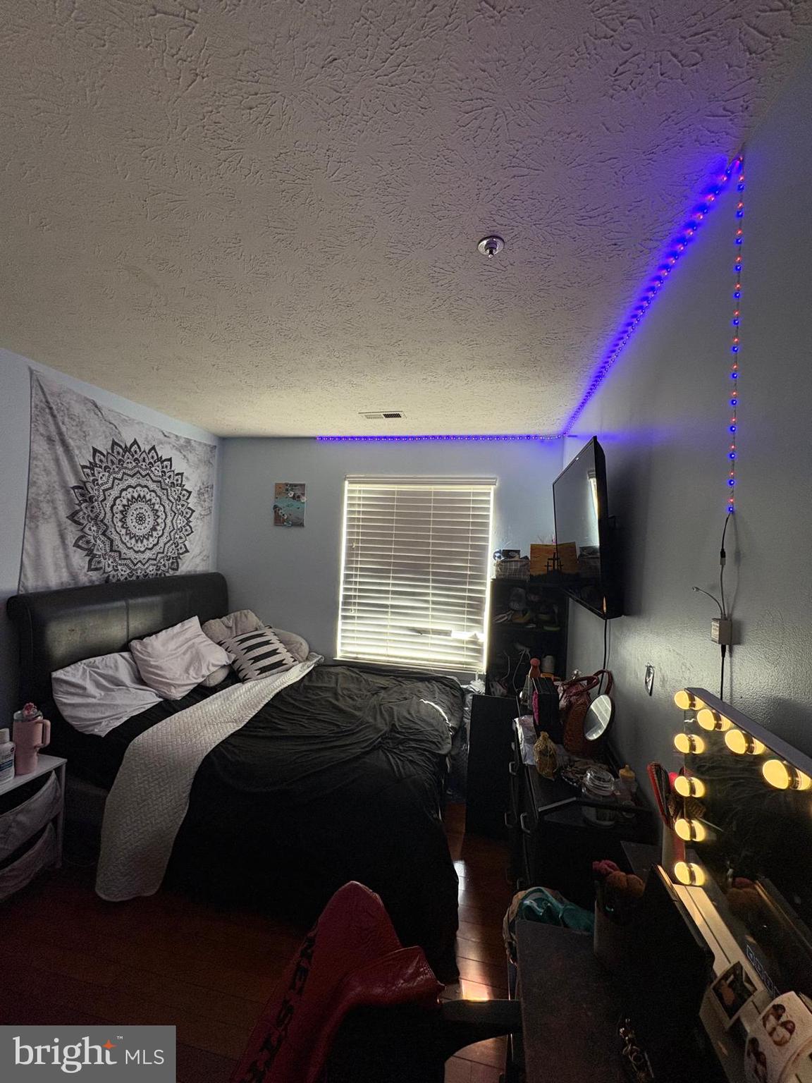 7148 Natures Road Columbia, MD 21046 - Photo 6 of 49 a bedroom with a bed and a flat tv screen