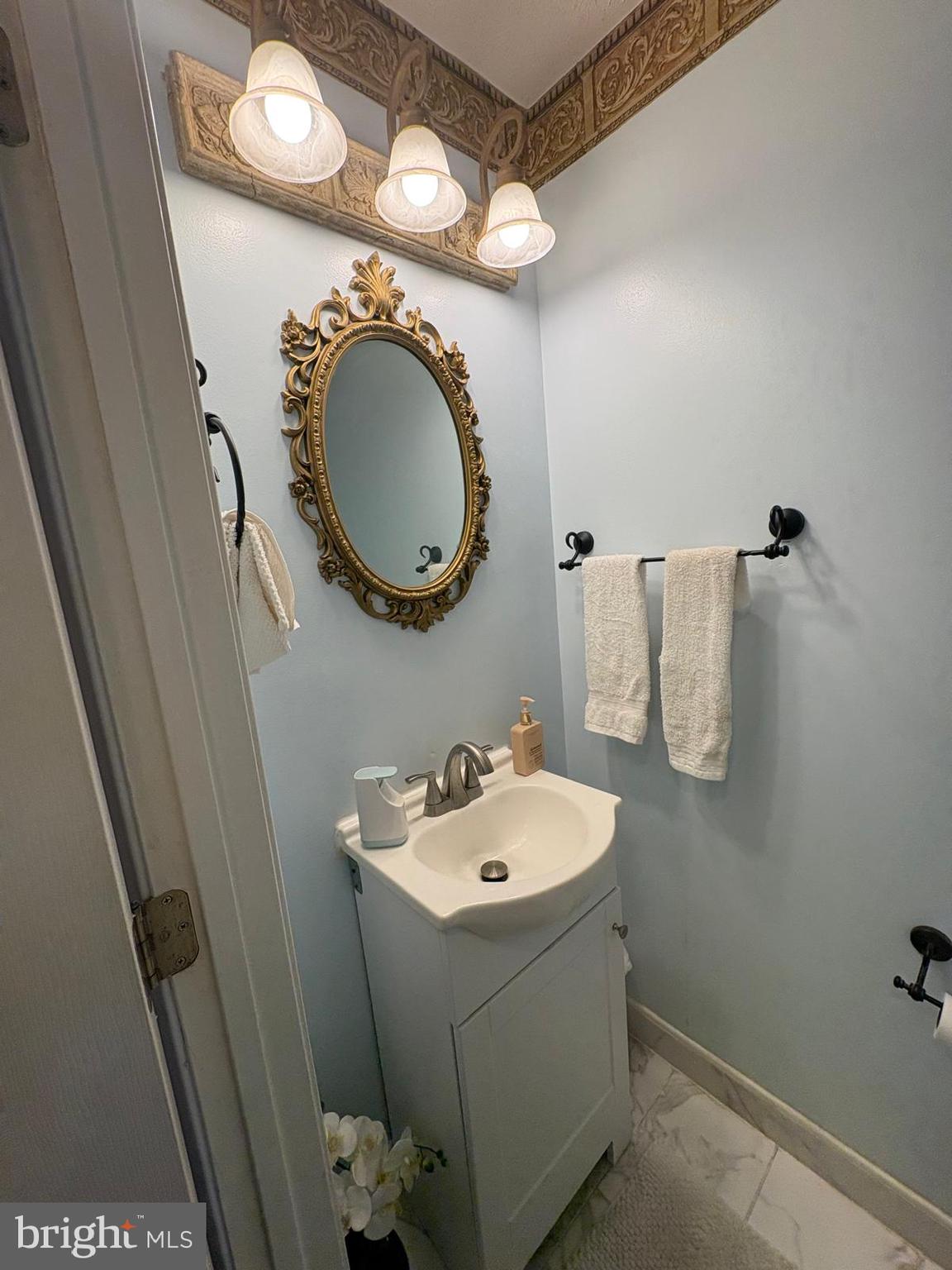 7148 Natures Road Columbia, MD 21046 - Photo 10 of 49 a bathroom with a sink and a mirror