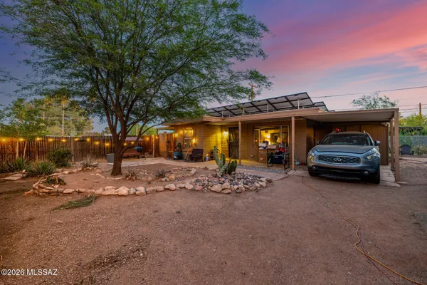 a view of a car park in front of house