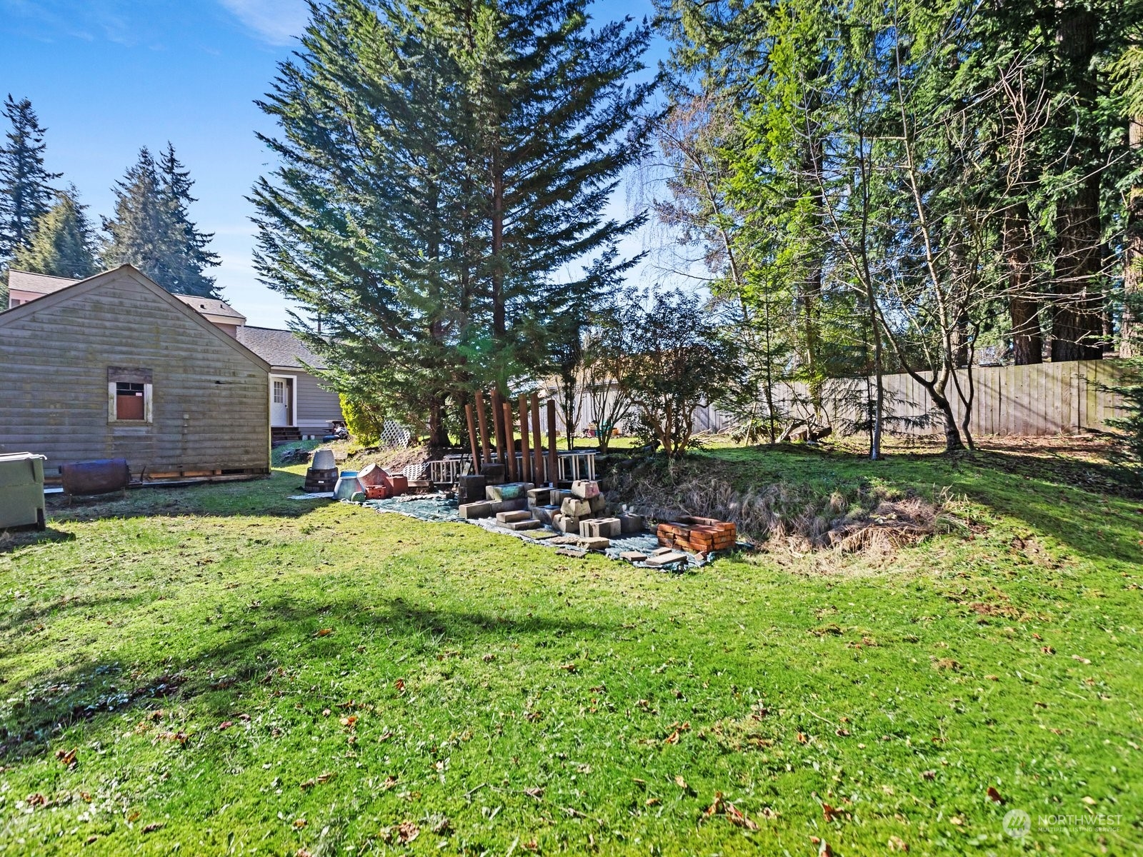 529 Cabot Road Everett, WA 98203 - Photo 28 of 40 a view of a house with backyard porch and sitting area