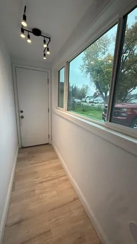 a view of an empty room with a window