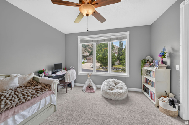 767 Draper View Road Draper, UT 84020 - Photo 35 of 71 Room featuring a large window, neutral carpeting, and light gray wall paint