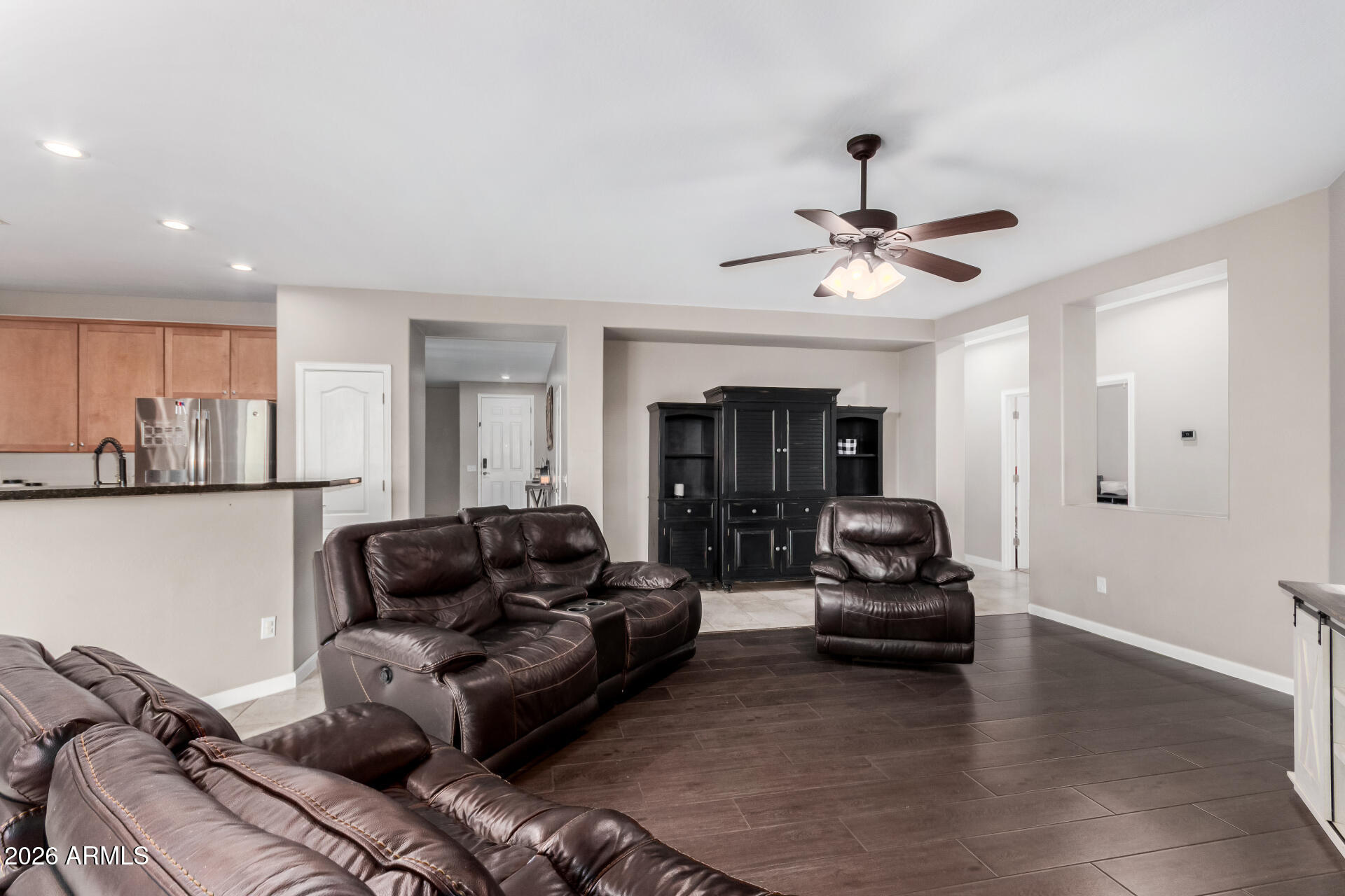 25828 North Desert Mesa Drive Surprise, AZ 85387 - Photo 11 of 37 a living room with furniture and a ceiling fan