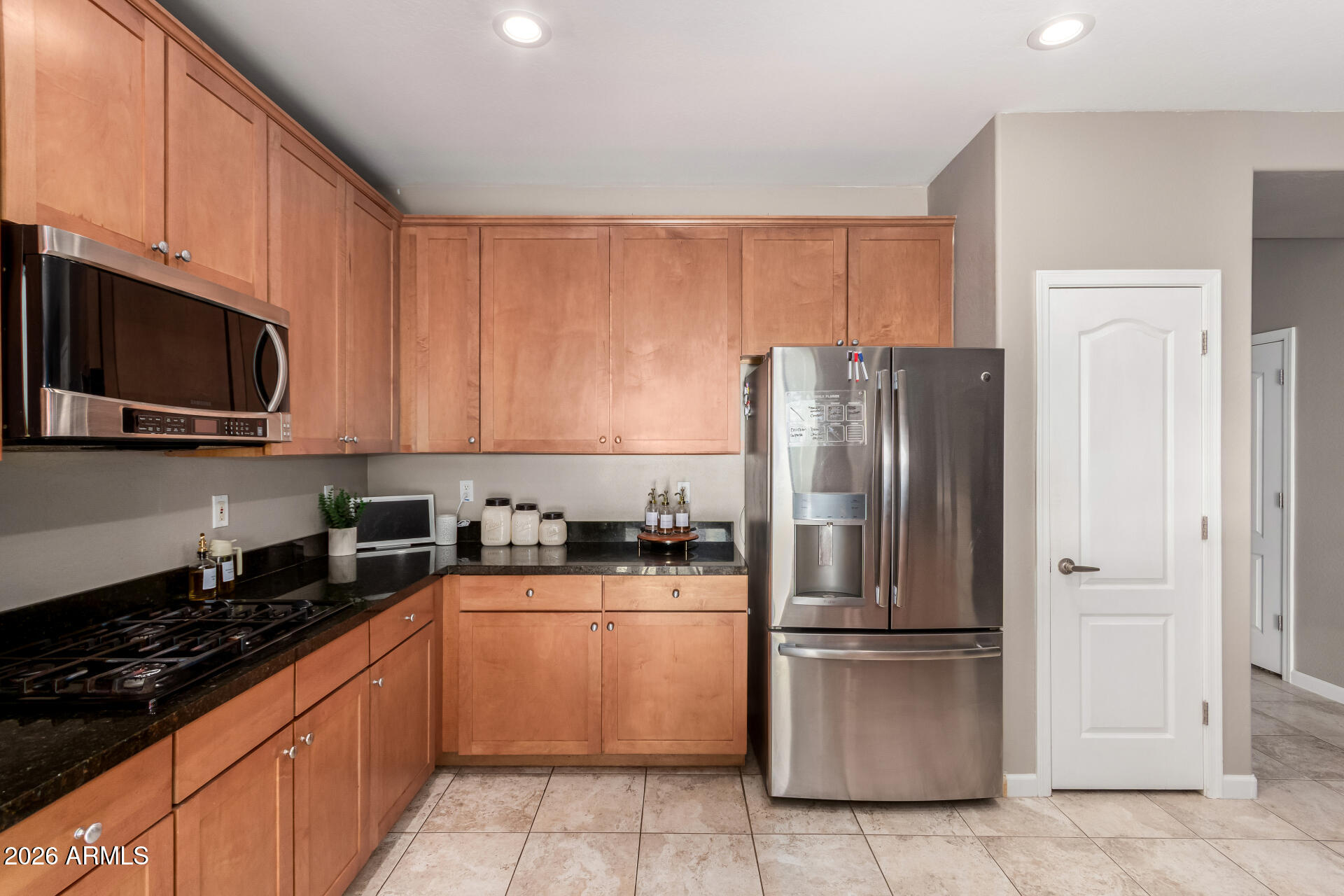 25828 North Desert Mesa Drive Surprise, AZ 85387 - Photo 15 of 37 a kitchen with a refrigerator sink and microwave