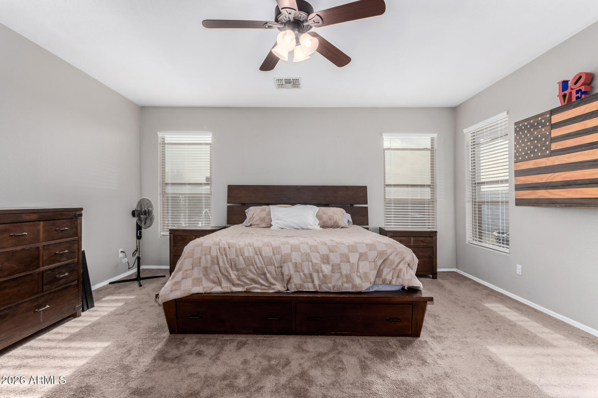 25828 North Desert Mesa Drive Surprise, AZ 85387 - Photo 17 of 37 a spacious bedroom with a bed and a window