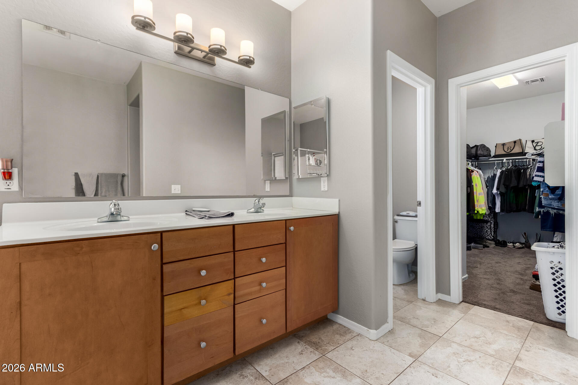 25828 North Desert Mesa Drive Surprise, AZ 85387 - Photo 21 of 37 a bathroom with a double vanity sink a and a mirror