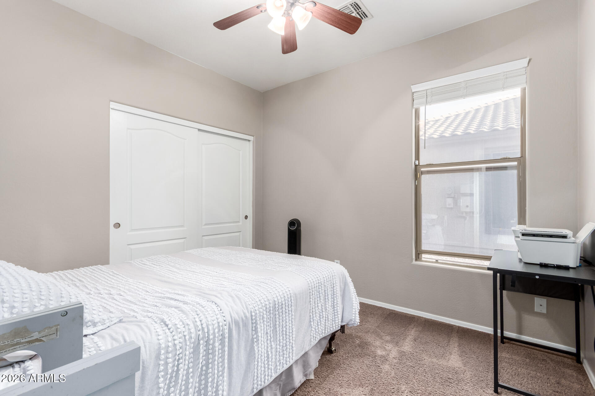 25828 North Desert Mesa Drive Surprise, AZ 85387 - Photo 22 of 37 a bedroom with a bed and a window
