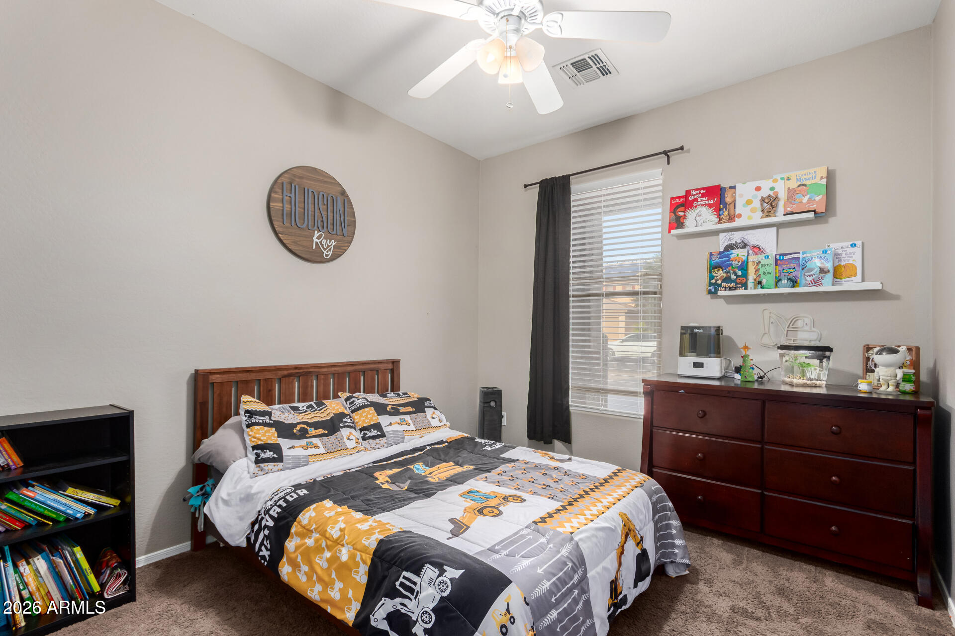 25828 North Desert Mesa Drive Surprise, AZ 85387 - Photo 24 of 37 a bedroom with a bed and a chandelier
