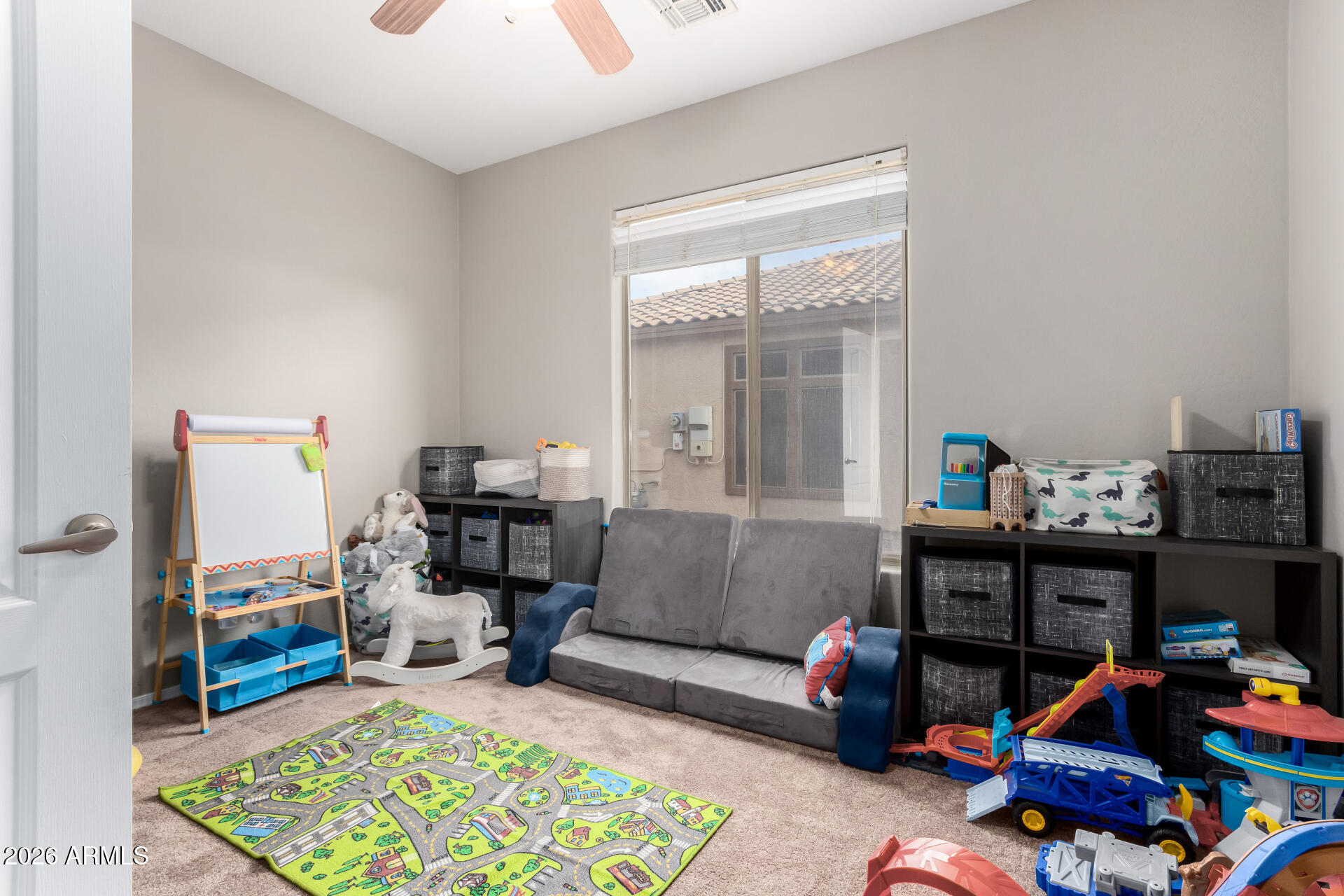 25828 North Desert Mesa Drive Surprise, AZ 85387 - Photo 28 of 37 a living room with furniture and a dining table