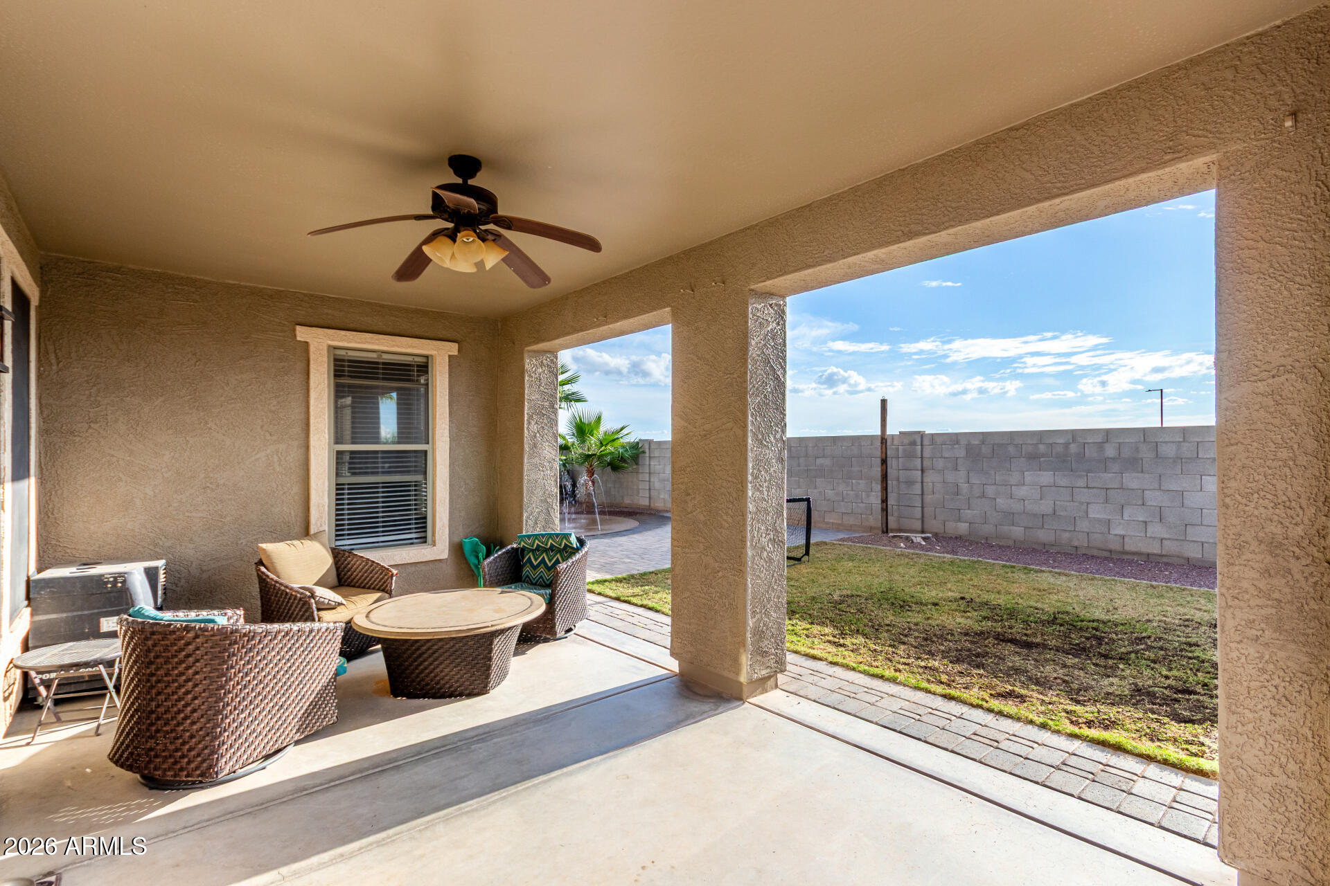 25828 North Desert Mesa Drive Surprise, AZ 85387 - Photo 31 of 37 a living room with couches and pool view