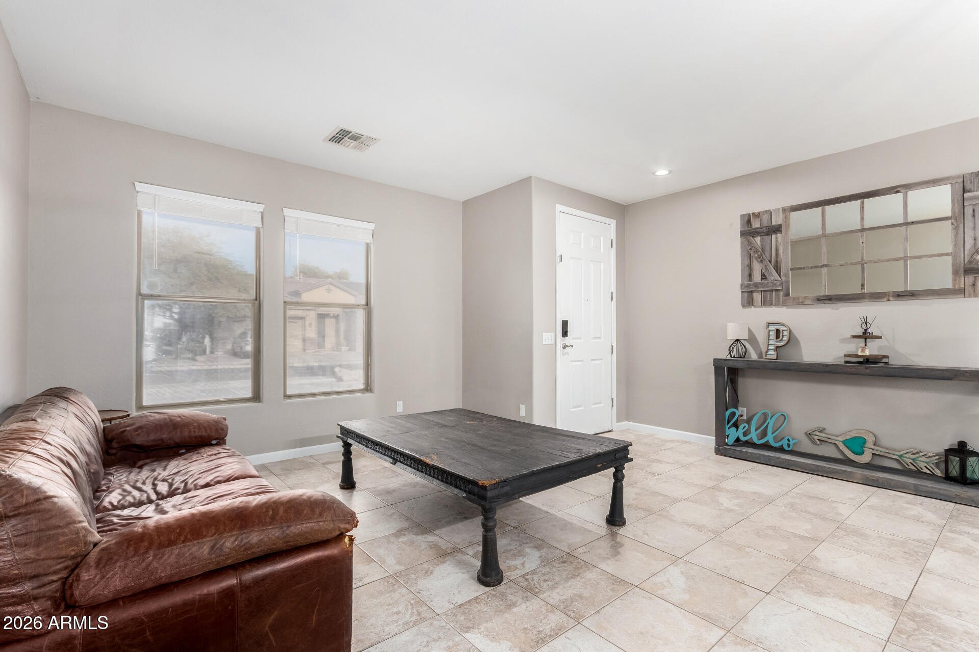 25828 North Desert Mesa Drive Surprise, AZ 85387 - Photo 3 of 37 a living room with furniture and a window