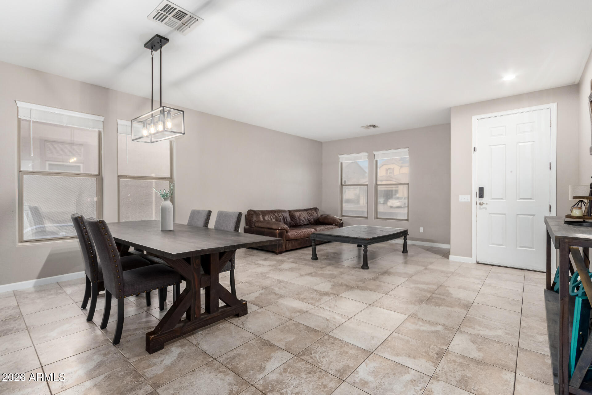 25828 North Desert Mesa Drive Surprise, AZ 85387 - Photo 4 of 37 a view of a dining room with furniture and window