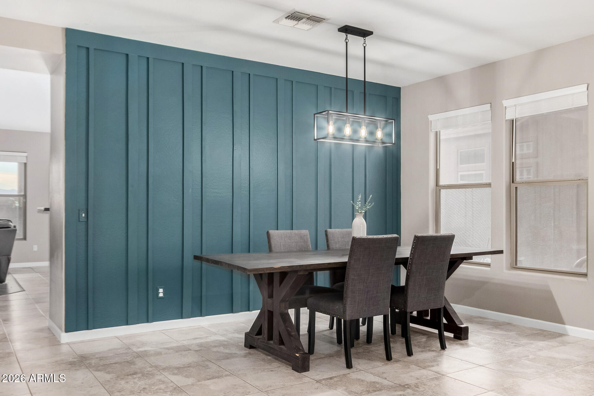 25828 North Desert Mesa Drive Surprise, AZ 85387 - Photo 6 of 37 a view of a dining room with furniture and chandelier