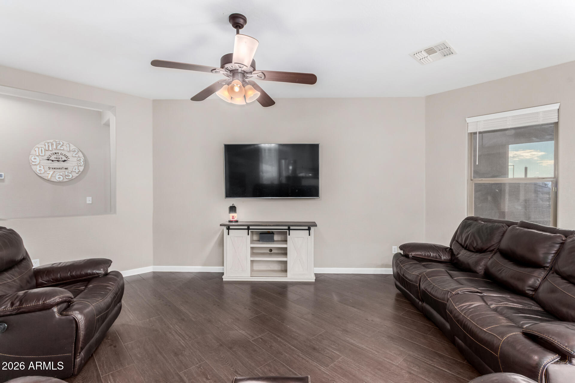 25828 North Desert Mesa Drive Surprise, AZ 85387 - Photo 9 of 37 a living room with furniture and a flat screen tv