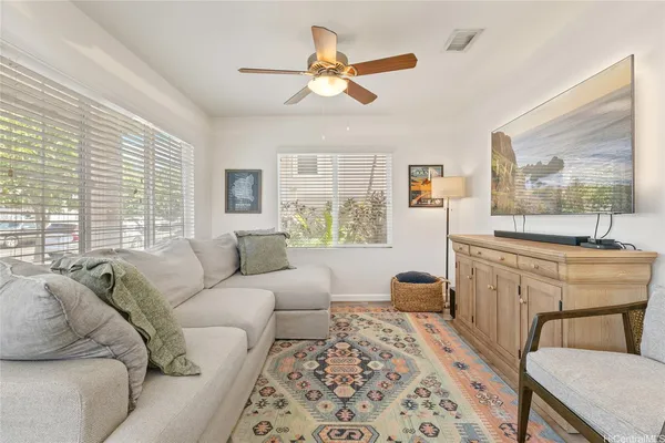 a living room with furniture and a large window