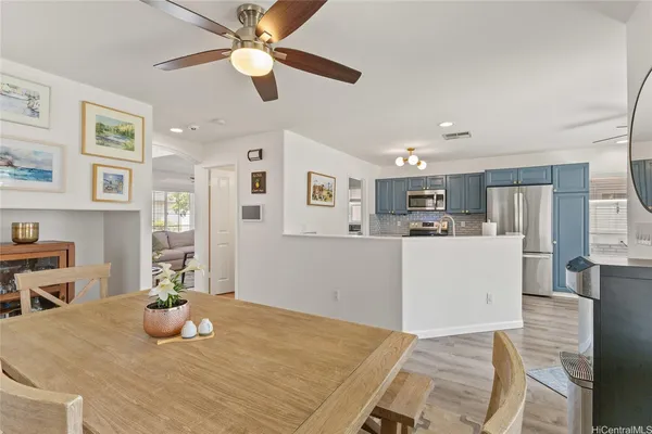 a living room with kitchen island furniture and a table
