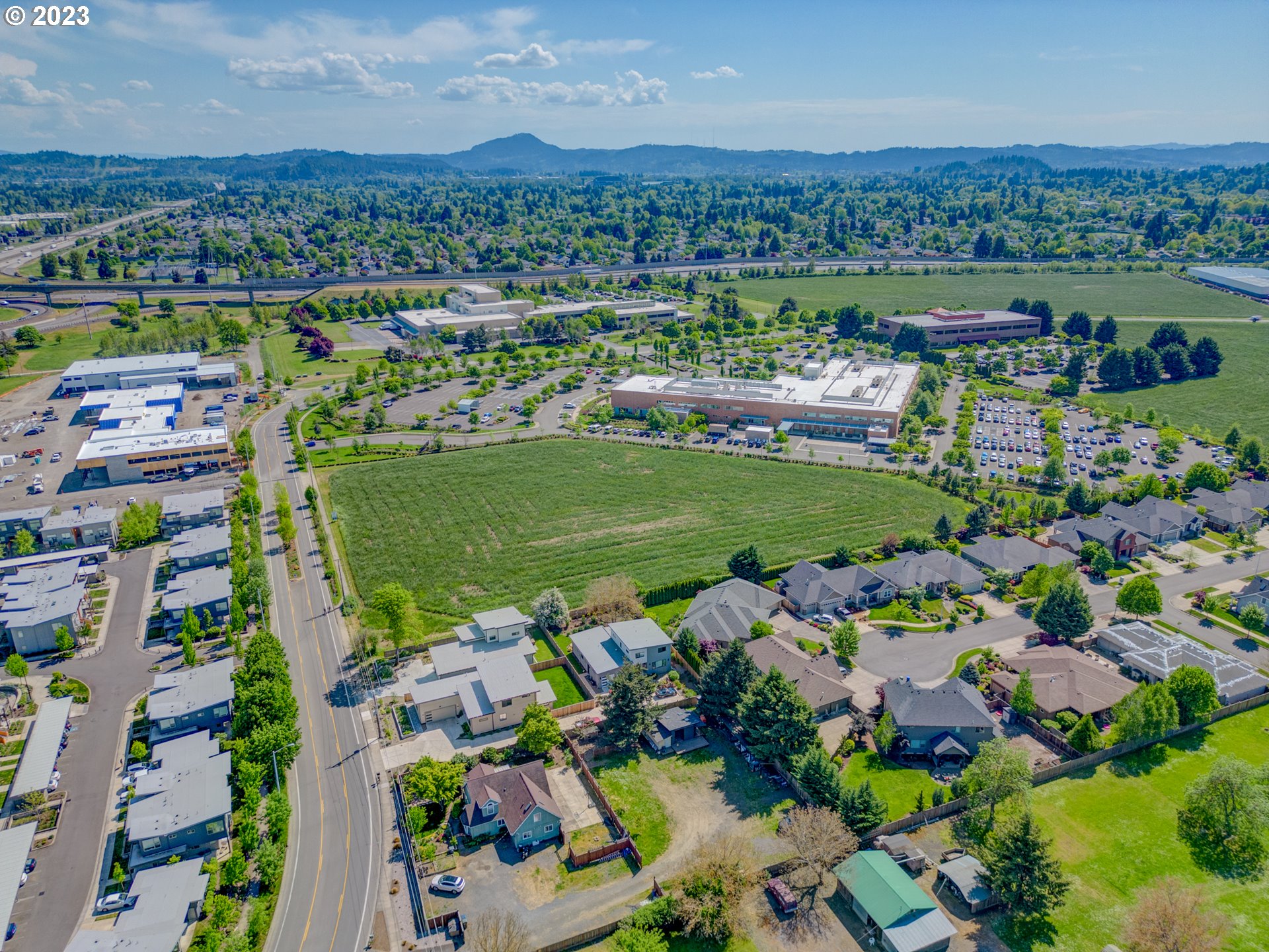 Old Coburg Road Eugene, OR 97408 - Photo 11 of 14 an aerial view of a city with lots of residential buildings and mountain view in back