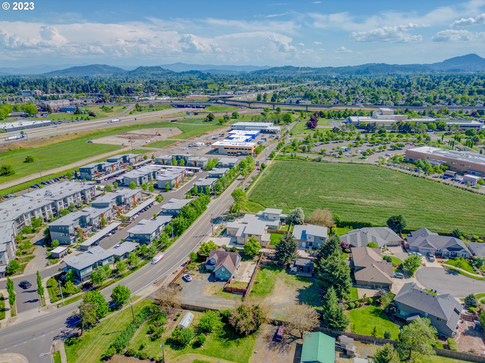 Old Coburg Road Eugene, OR 97408 - Photo 12 of 14 an aerial view of a city with lots of residential buildings ocean and mountain view in back