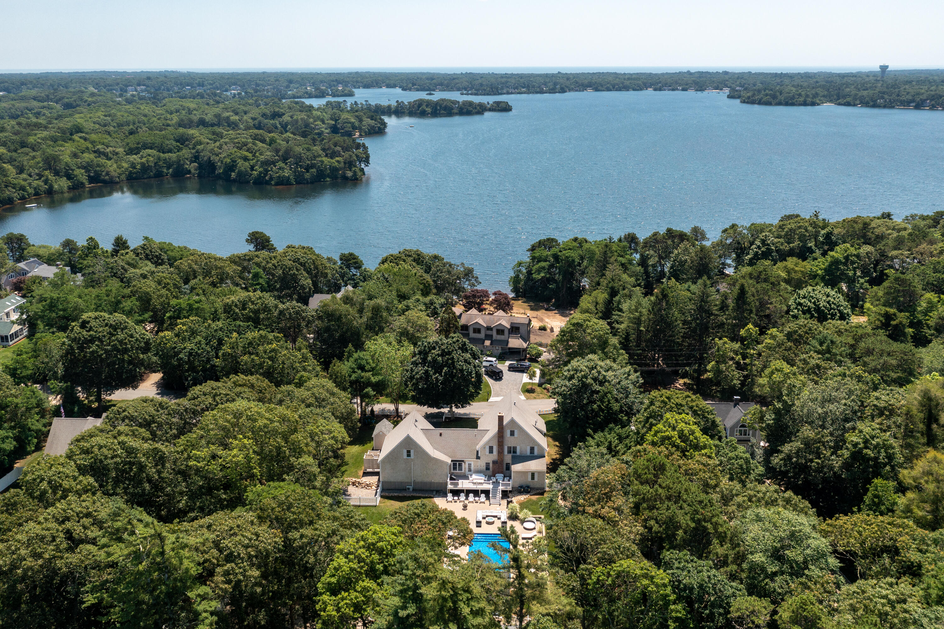 125 Lakeview Drive Centerville, MA 02632 - Photo 2 of 28 an aerial view of a house with a yard and lake view