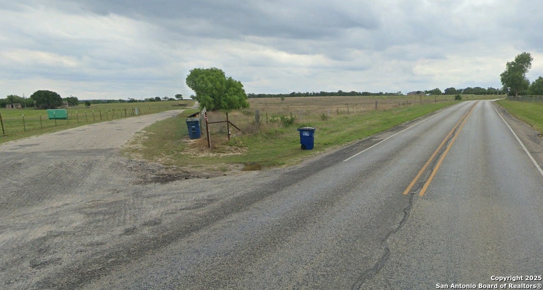 800 Rohlf Road Seguin, TX 78155 - Photo 2 of 4 a view of a lake with a big yard