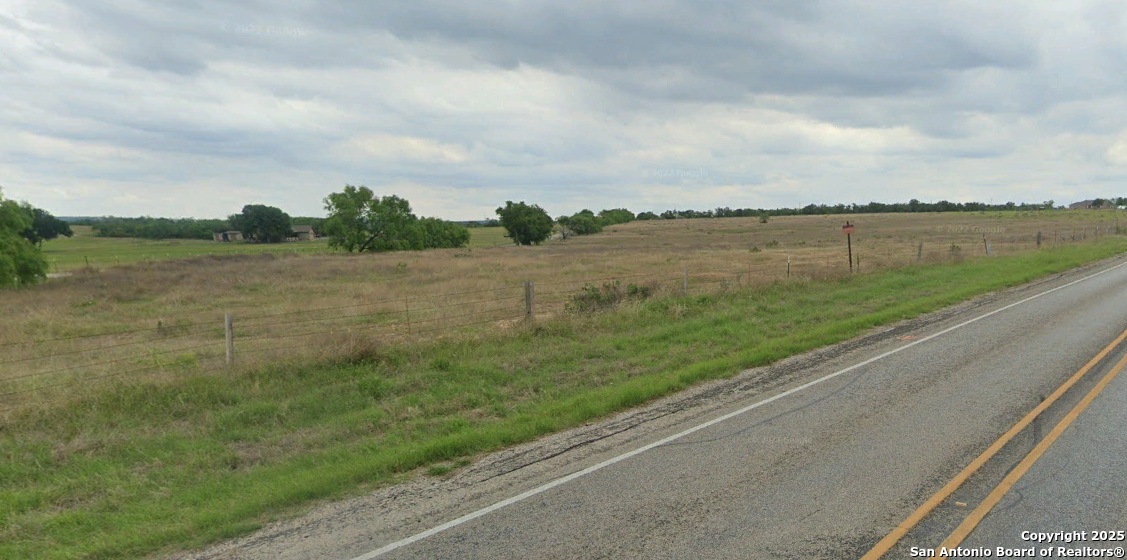 800 Rohlf Road Seguin, TX 78155 - Photo 3 of 4 a view of a lake from a yard