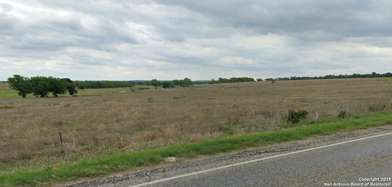 800 Rohlf Road Seguin, TX 78155 - Photo 4 of 4 a view of a lake from a yard