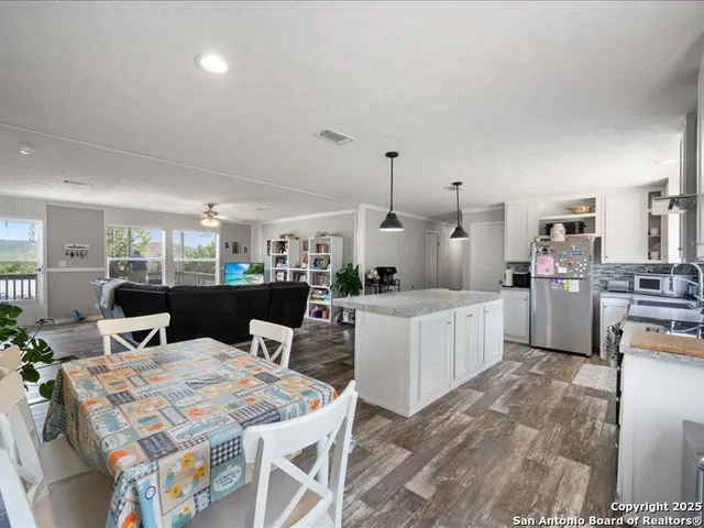 a kitchen with counter top space and appliances