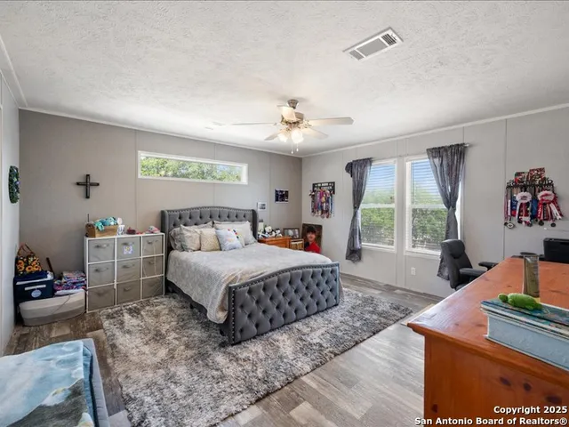 a bedroom with a bed and a dresser