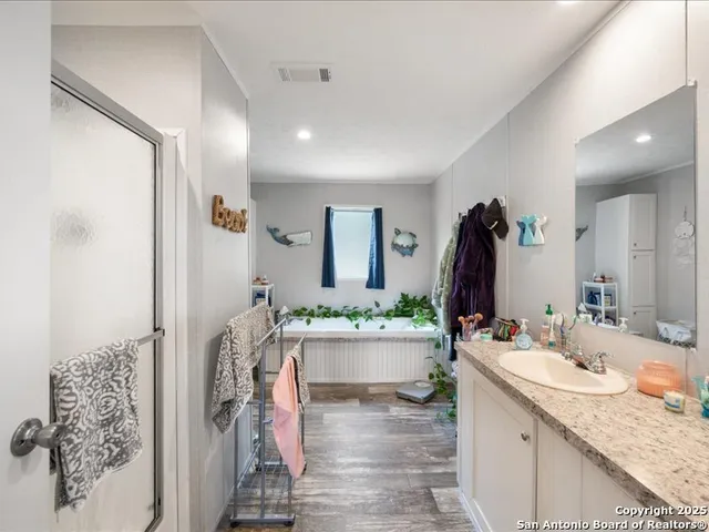 a bedroom with a bed and a desk