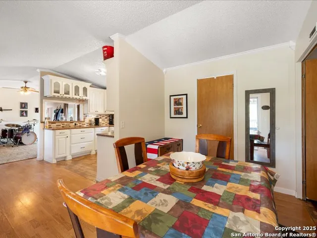 a spacious bathroom with a granite countertop sink a mirror a shower and a bathtub