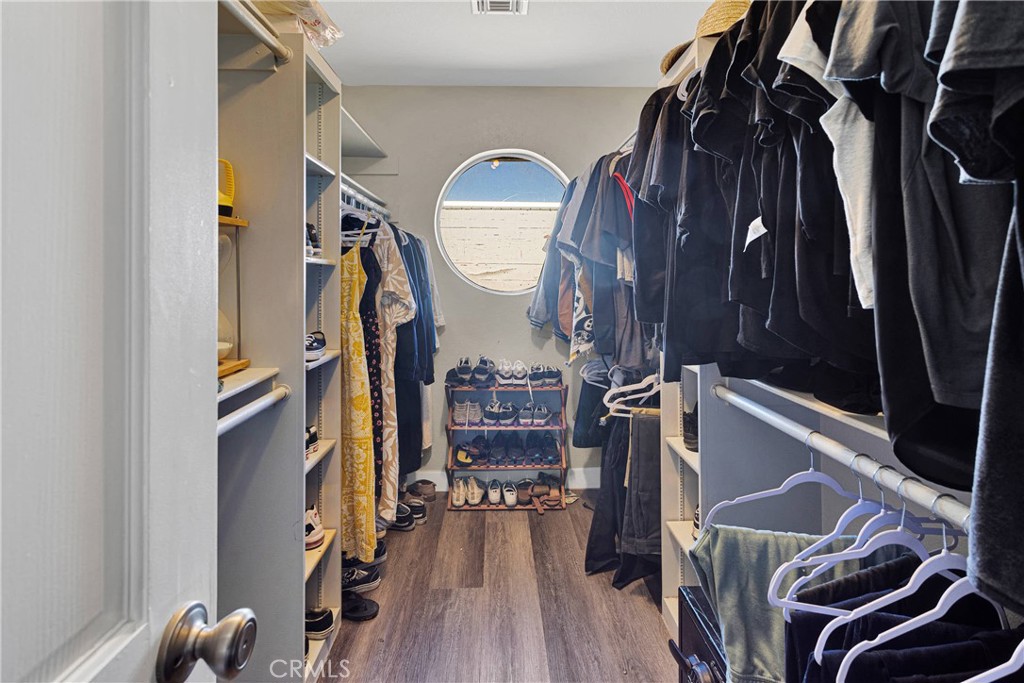 10325 Sheep Creek Road Phelan, CA 92371 - Photo 21 of 47 a view of walk in closet with clothes and shoes