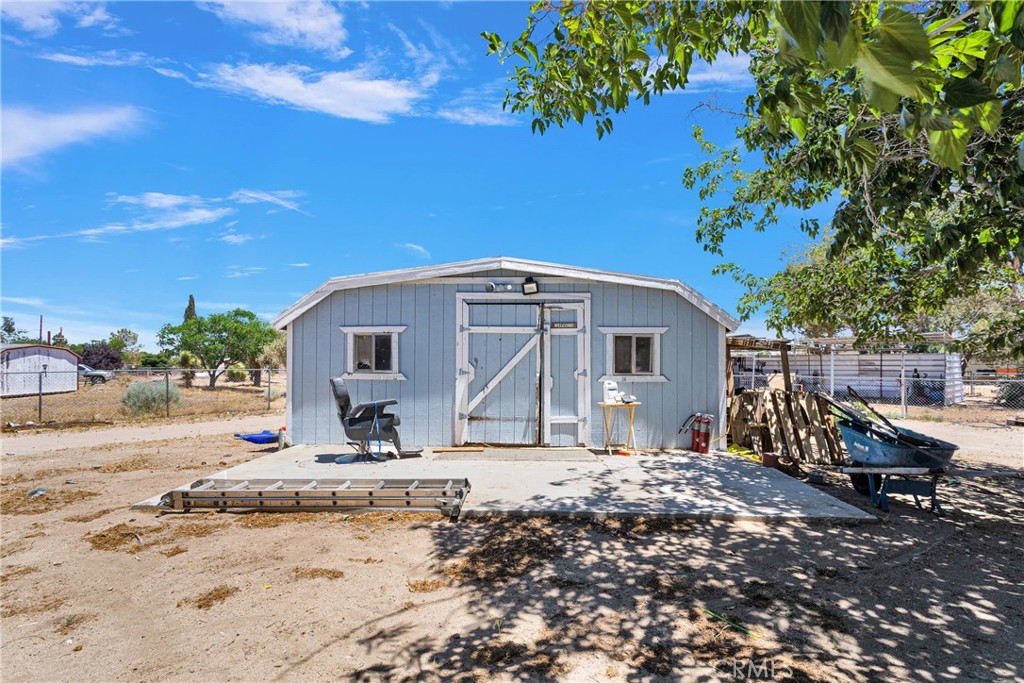 10325 Sheep Creek Road Phelan, CA 92371 - Photo 36 of 47 a house with trees in the background