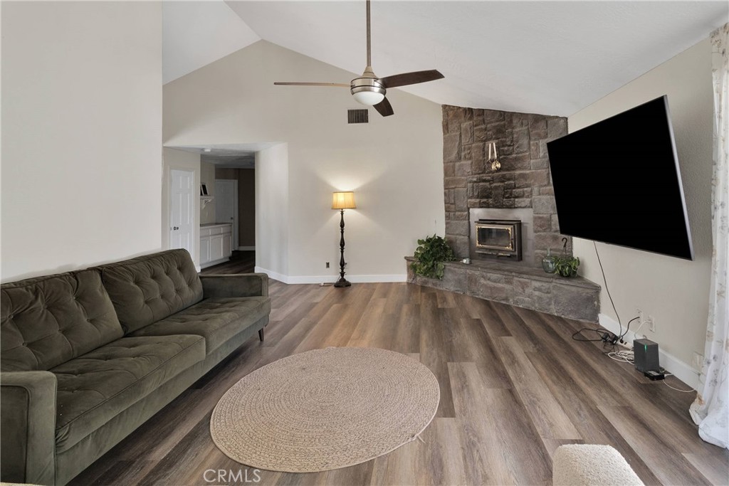 10325 Sheep Creek Road Phelan, CA 92371 - Photo 8 of 47 a living room with furniture and a flat screen tv