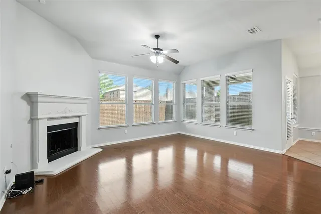 a view of kitchen with stainless steel appliances refrigerator oven and cabinets