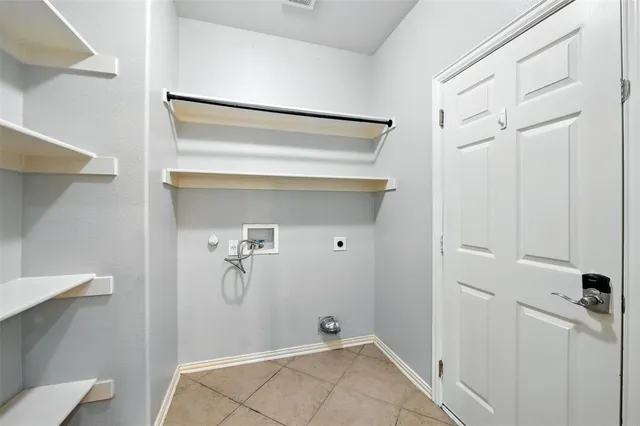 a view of a big room with chandelier fan and entryway