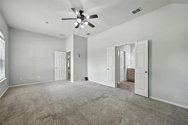 a view of an empty room with a window
