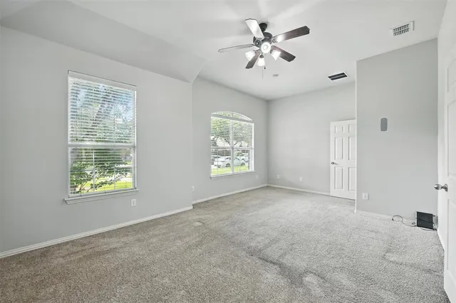 a bathroom with a double vanity sink mirror and shower