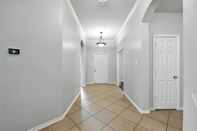 a view of a kitchen with granite countertop cabinets and chandelier