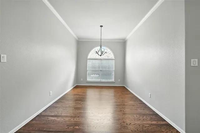 a kitchen with granite countertop a sink a counter top space appliances and cabinets