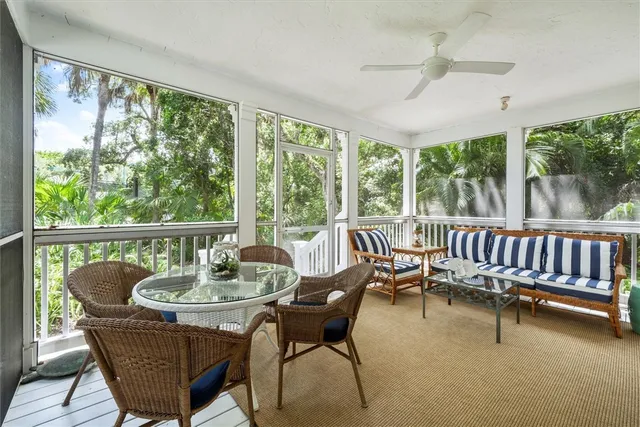 a balcony with furniture and a garden