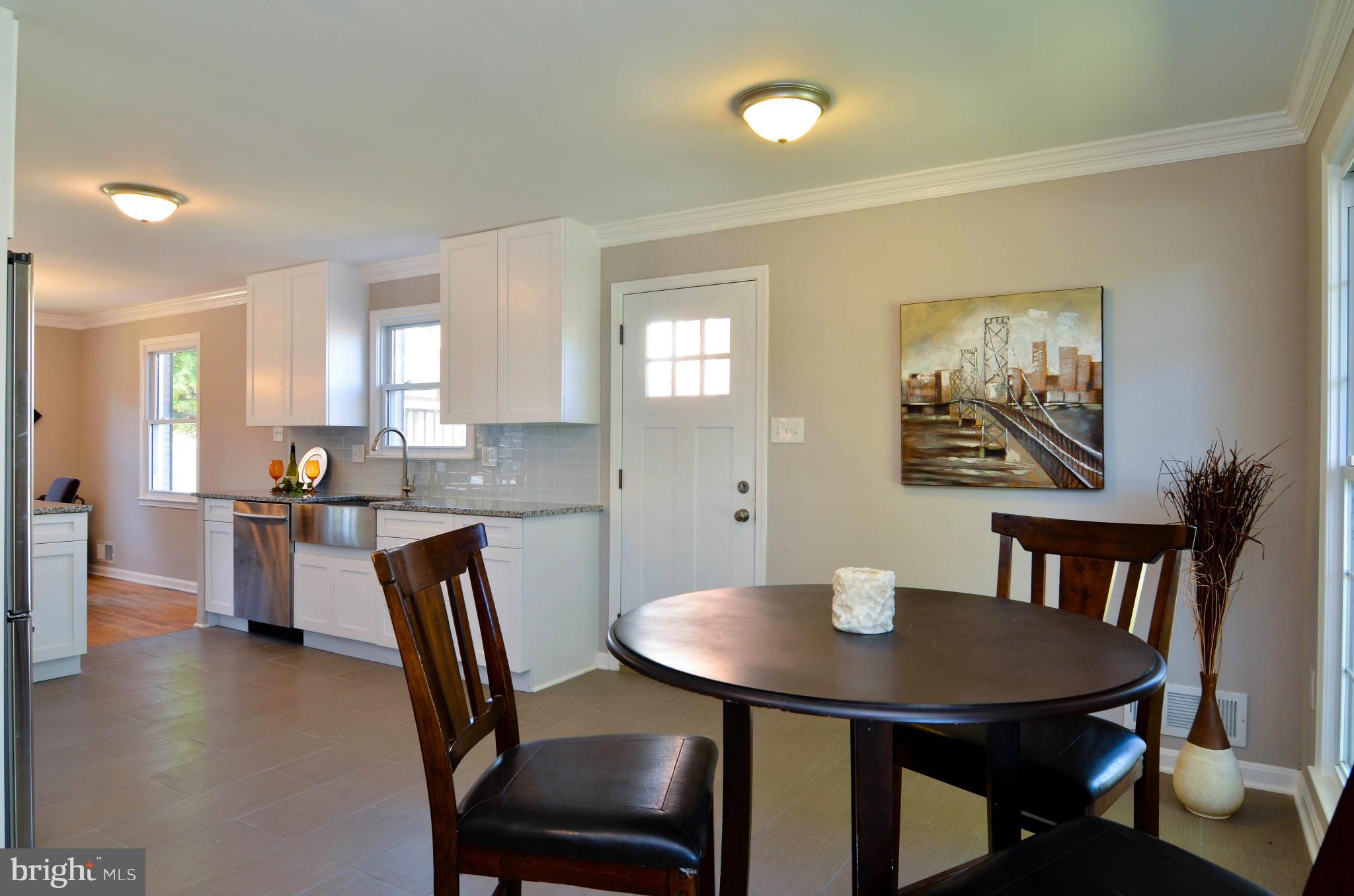 13310 Tamarack Road Silver Spring, MD 20904 - Photo 5 of 30 a view of a dining room with furniture and a table