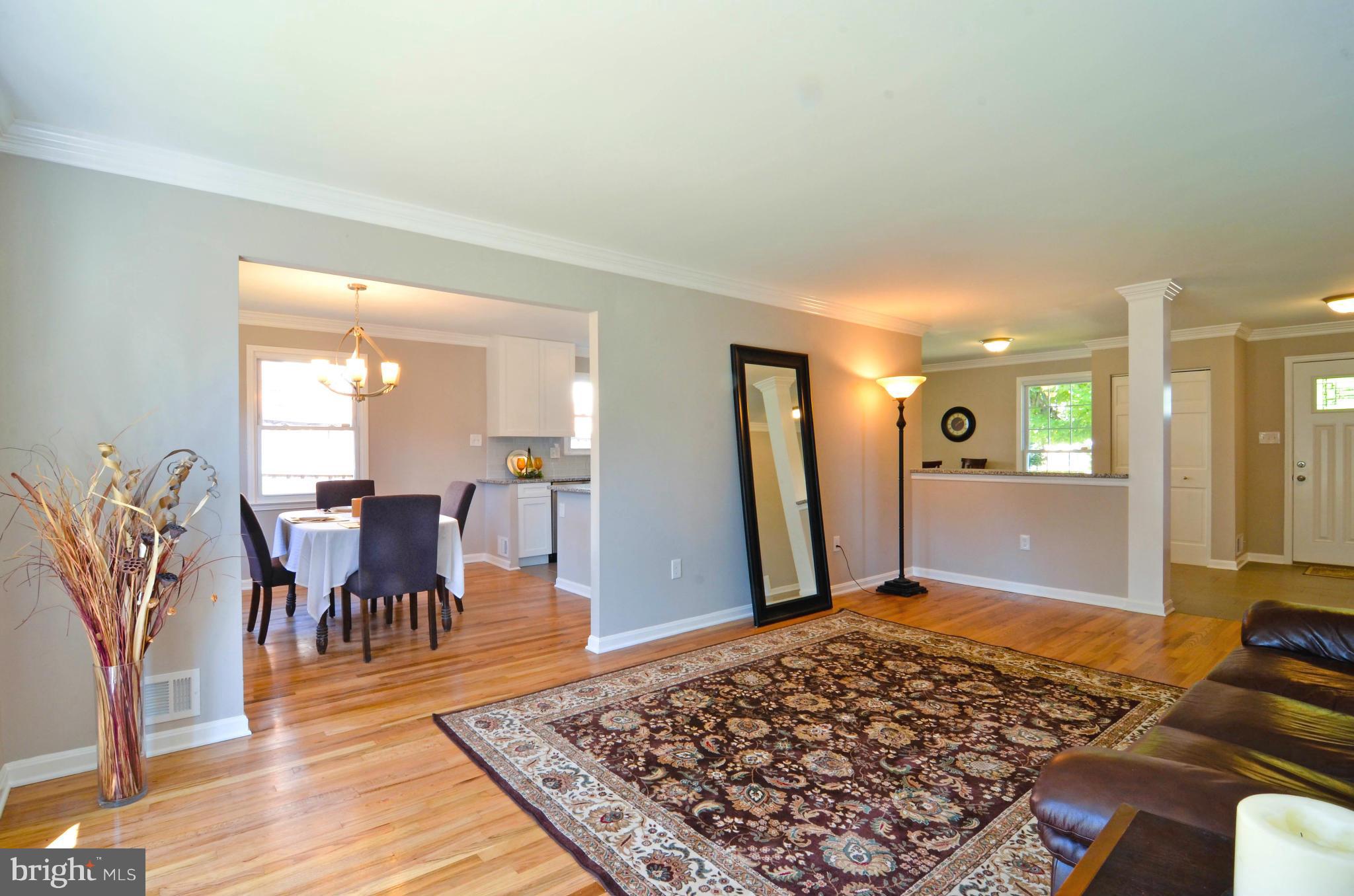 13310 Tamarack Road Silver Spring, MD 20904 - Photo 8 of 30 a living room with dining area and wooden floor