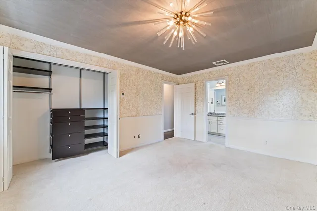 a kitchen with stainless steel appliances granite countertop a stove top oven a sink dishwasher and a fireplace with wooden floor