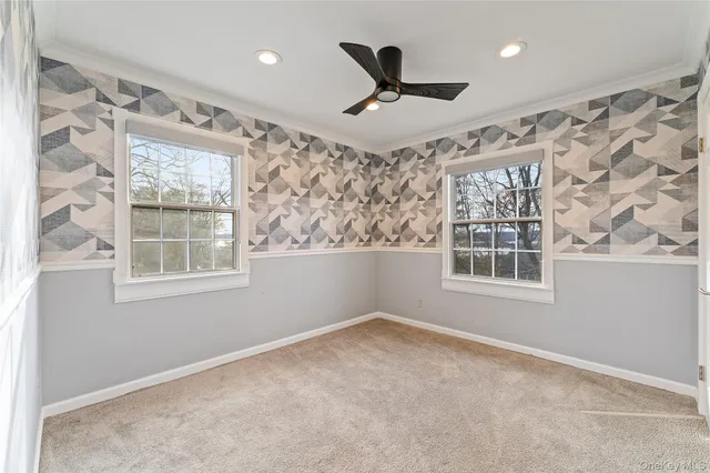 a large kitchen with granite countertop a stove and wooden floor
