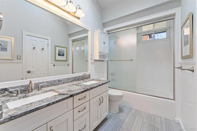 an empty room with closet and fan