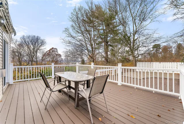 a view of a hallway with a painting on the wall