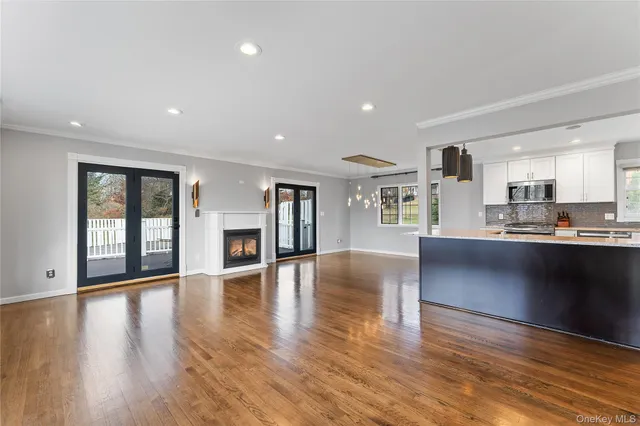 a view of kitchen with cabinets and wooden floor